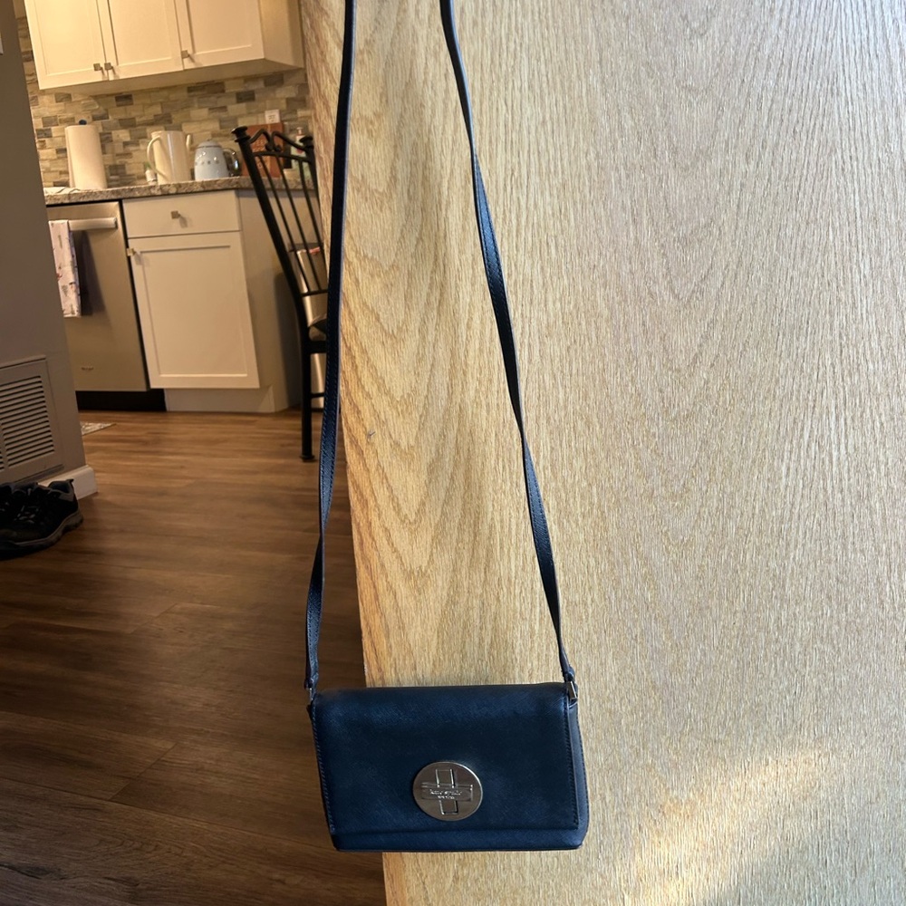 Kate Spade Elegant Black Crossbody Bag with Silver Emblem